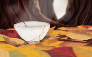 White china bowl with shiny gold glue outlining the cracks.