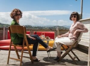 Two women relaxing in deck chairs